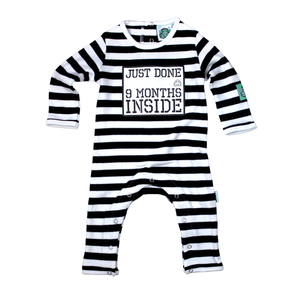Black and White Stripy Baby Romper with slogan Just Done 9 Months Inside