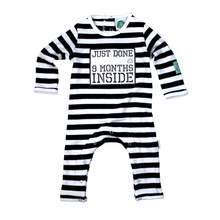 Load image into Gallery viewer, Black and White Striped Newborn Baby Long-Sleeved Romper featuring Just Done 9 Months Inside® slogan
