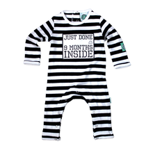 Load image into Gallery viewer, Black and White Stripy Baby Romper with slogan Just Done 9 Months Inside