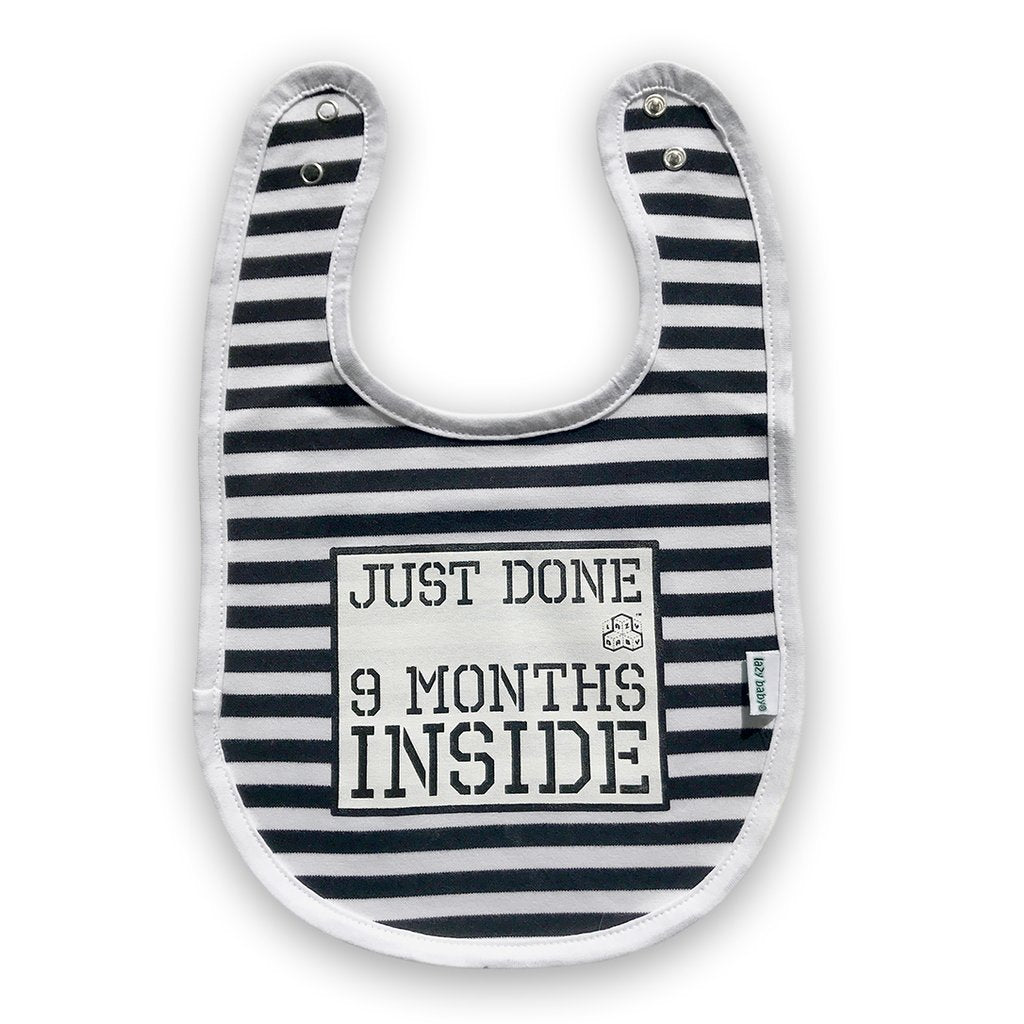 Black and white stripy bib featuring Just Done 9 Months Inside slogan