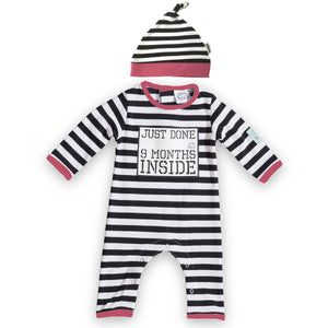 Baby Romper in black and white stripes with pink edging featuring Just Done 9 Months Inside slogan, and baby hat in matching colours